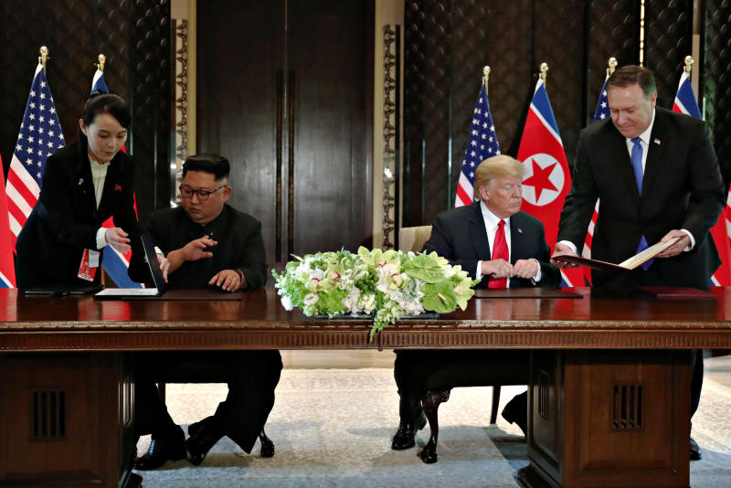 20180612 kim and trump with aide.jpg