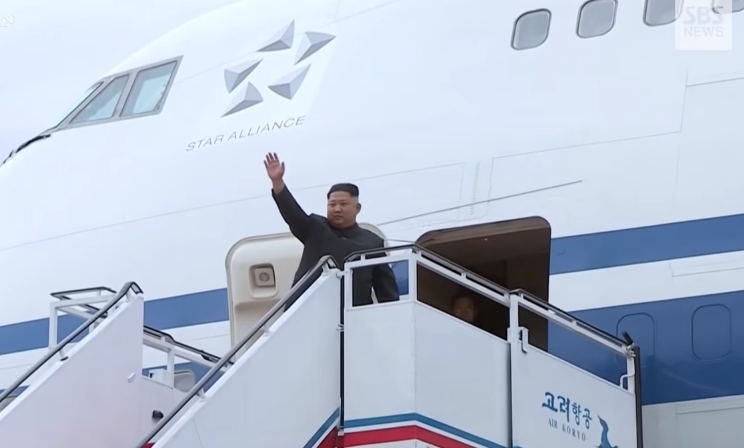 kim waves at PY aiport depart.jpg