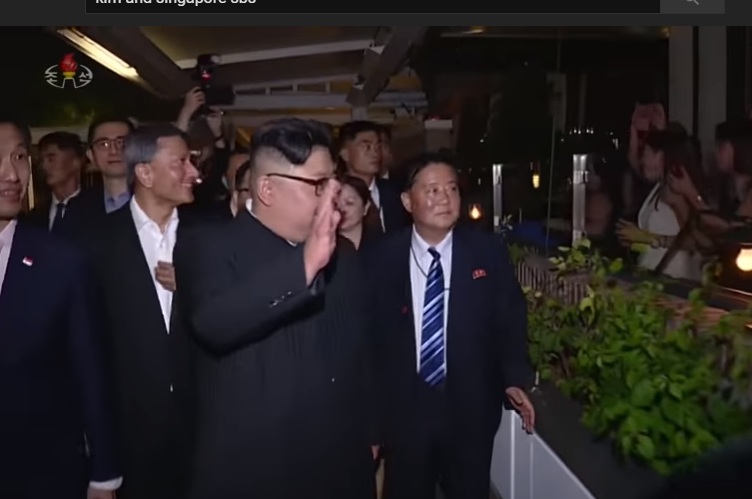 kim waves at pool.jpg