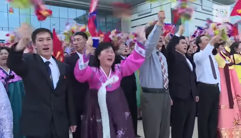 py airport crowd wave.jpg