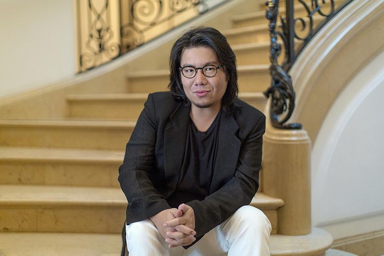 Kevin Kwan on stairs.jpg