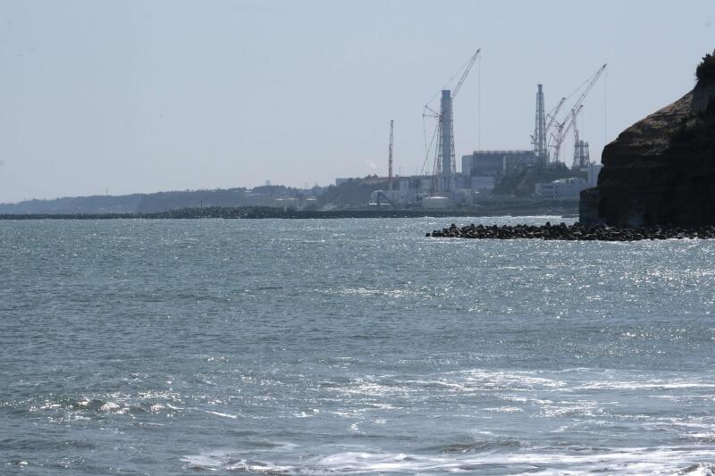 20210413 - This picture taken on March 10, 2021 of the coast of Futaba town, in Fukushima prefecture, shows the Tokyo Electric Power Company Holdings (TEPCO) Fukushima Daiichi nuclear power plant (top) (AFP).jpg