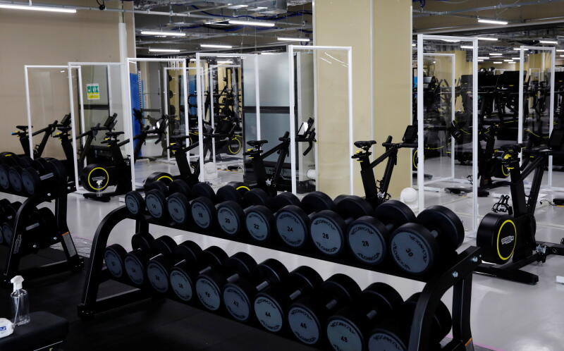 20210622 - Partitions are installed at the fitness center at the multi-function complex (Reuters).jpg