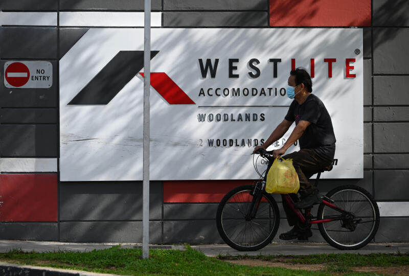 20210625 - Migrant worker cycling outside the Westlite Dormitory Woodlands (ST).jpg